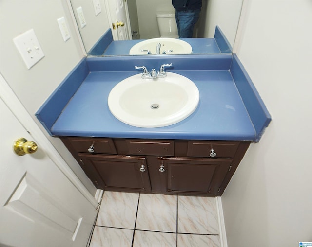 bathroom with vanity and toilet