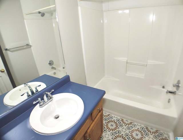 bathroom with tile patterned floors, vanity, and washtub / shower combination