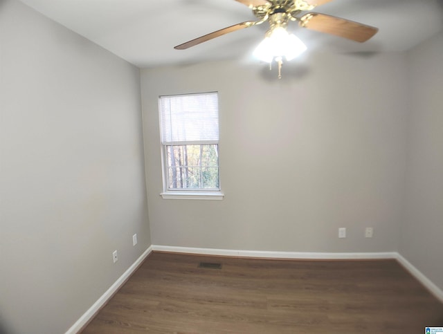 empty room featuring dark hardwood / wood-style floors