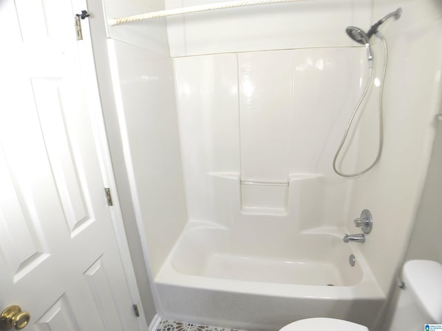 bathroom with toilet and shower / bathtub combination