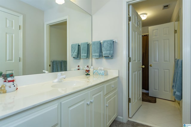 bathroom with vanity and tile patterned floors