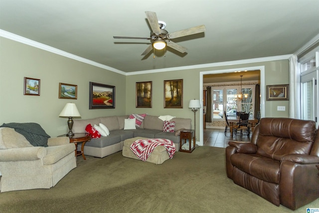 living room featuring carpet flooring, ceiling fan with notable chandelier, and ornamental molding