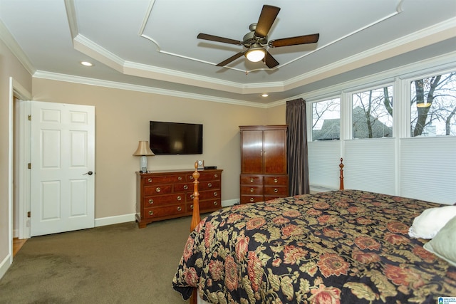 carpeted bedroom with ceiling fan, crown molding, and a tray ceiling