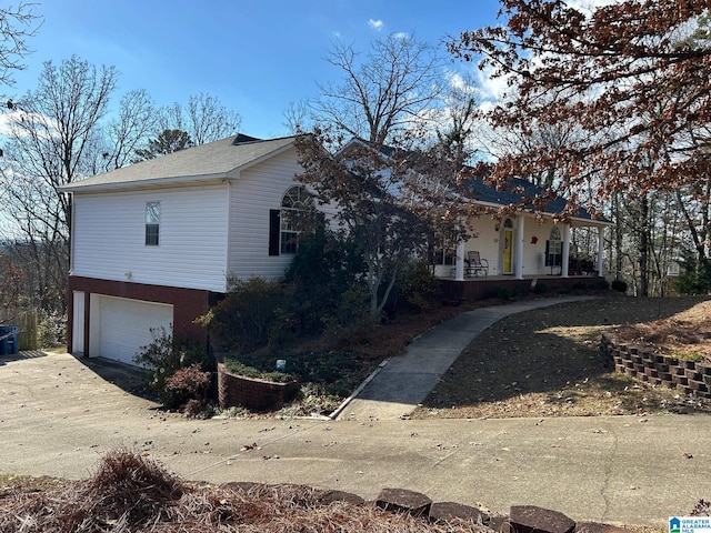 view of front of house with a porch and a garage