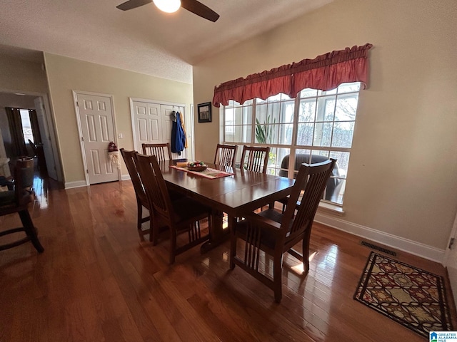 dining area featuring ceiling fan and dark hardwood / wood-style floors