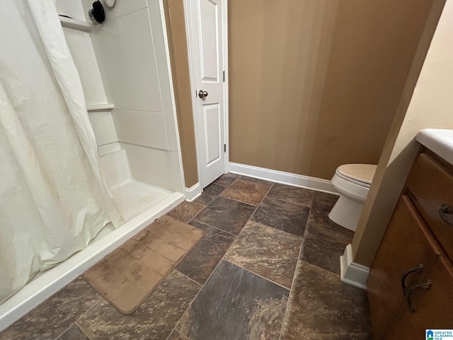 bathroom featuring walk in shower and toilet