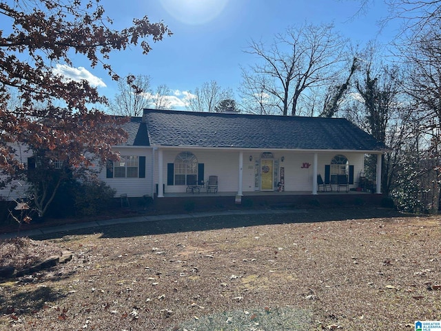 single story home with a porch