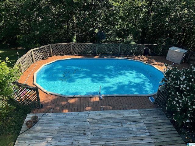 view of pool with a wooden deck