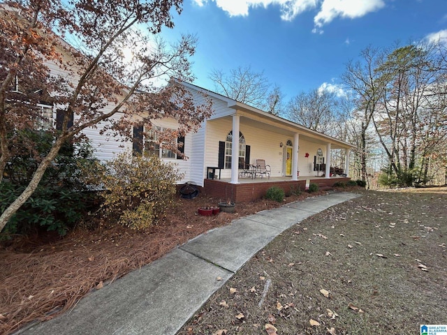 view of home's exterior featuring covered porch