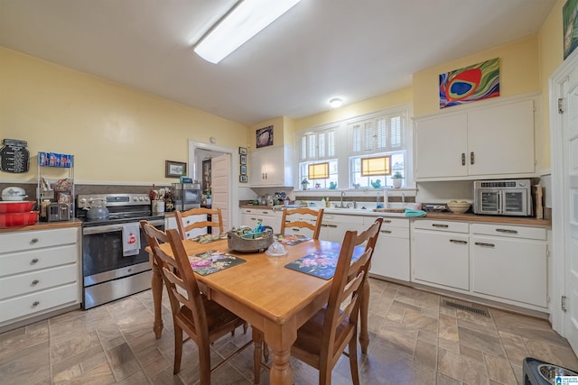 dining space featuring sink