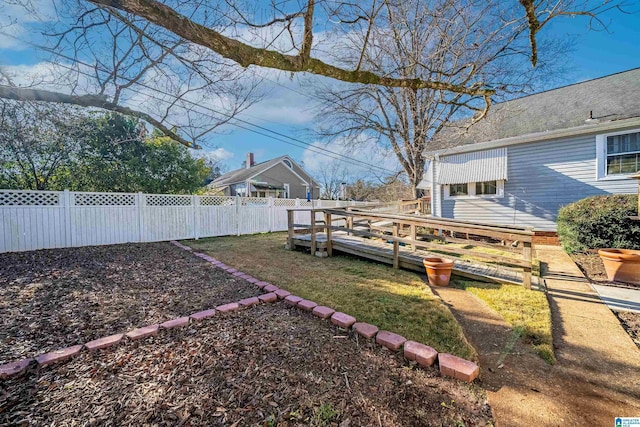 view of yard featuring a wooden deck