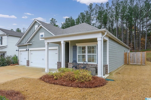 view of front of home with covered porch and a garage