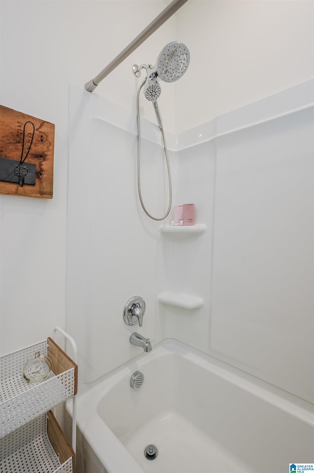 bathroom with washtub / shower combination