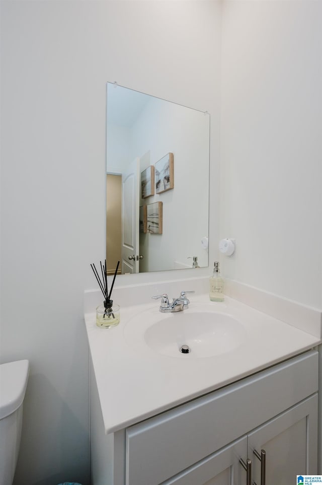 bathroom with vanity and toilet