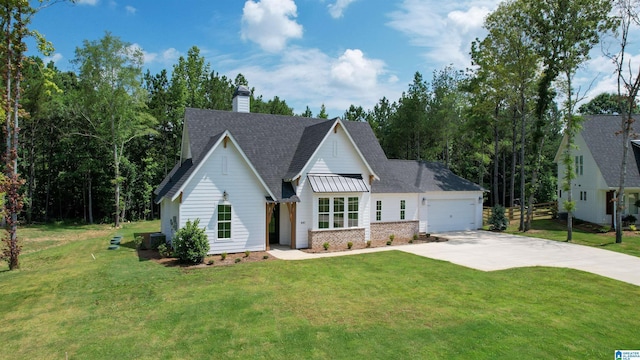 view of front of house with a front lawn and a garage