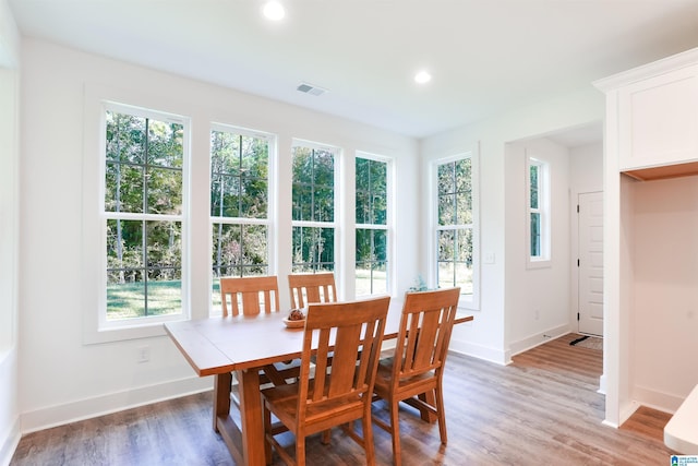 dining area with wood-type flooring