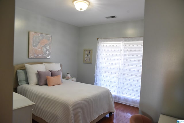 bedroom featuring dark hardwood / wood-style flooring