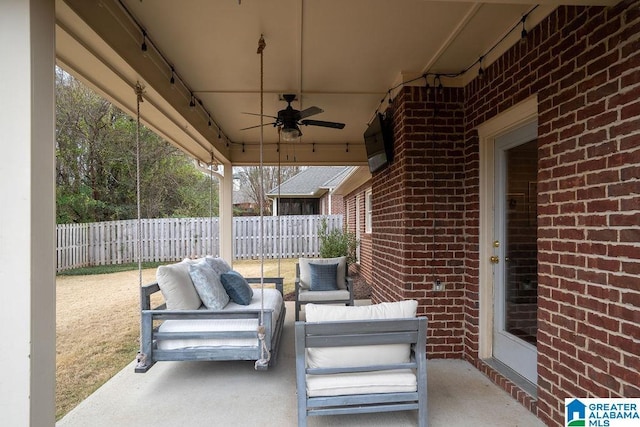 view of patio with ceiling fan and an outdoor hangout area