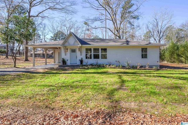 single story home with a front yard and a carport