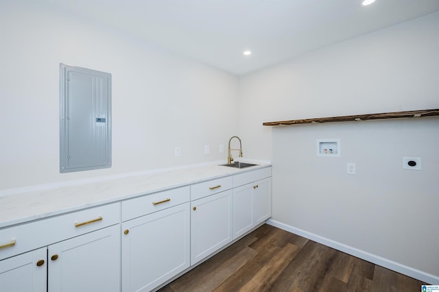 washroom with sink, electric dryer hookup, dark hardwood / wood-style floors, electric panel, and hookup for a washing machine