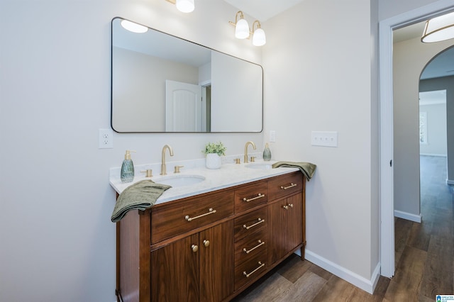 bathroom featuring hardwood / wood-style flooring and vanity