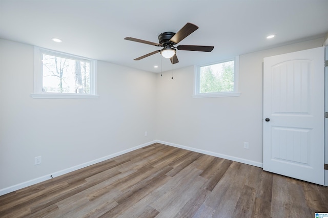 spare room with ceiling fan and light hardwood / wood-style flooring