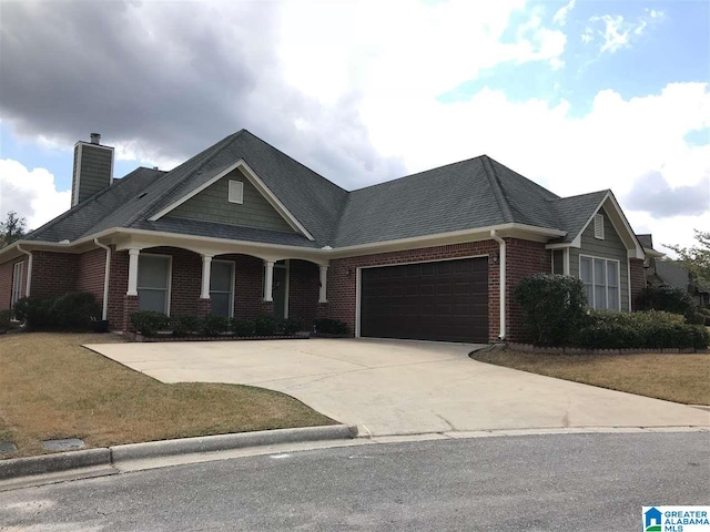 view of front facade featuring a garage and a front yard