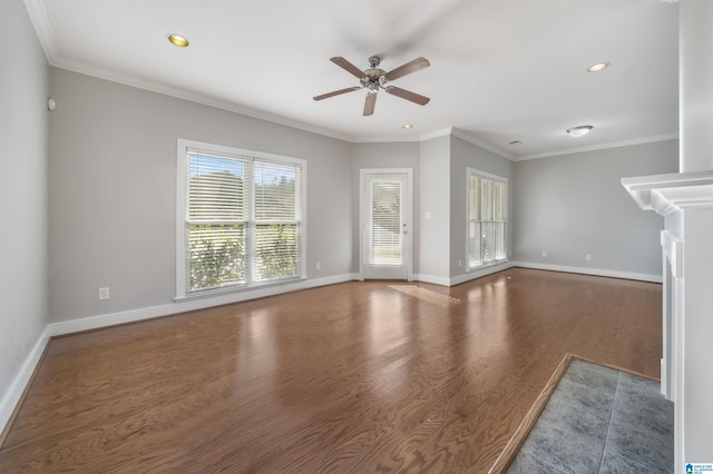 unfurnished living room featuring ceiling fan, dark hardwood / wood-style flooring, and ornamental molding