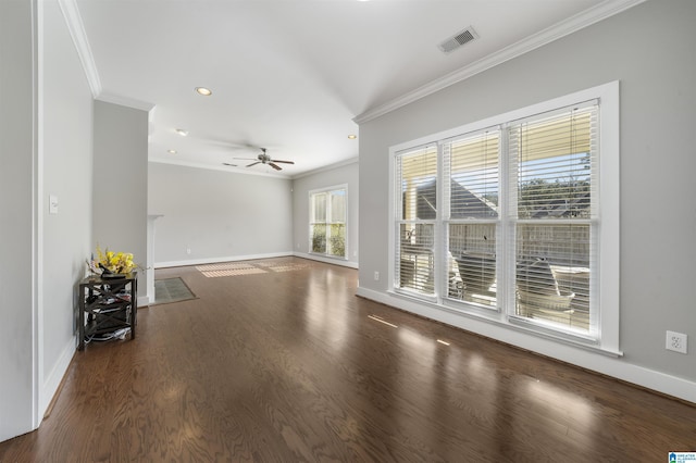 unfurnished living room featuring ceiling fan, dark hardwood / wood-style flooring, and ornamental molding