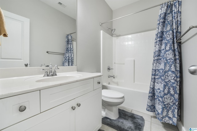 full bathroom with tile patterned flooring, vanity, toilet, and shower / bath combo with shower curtain