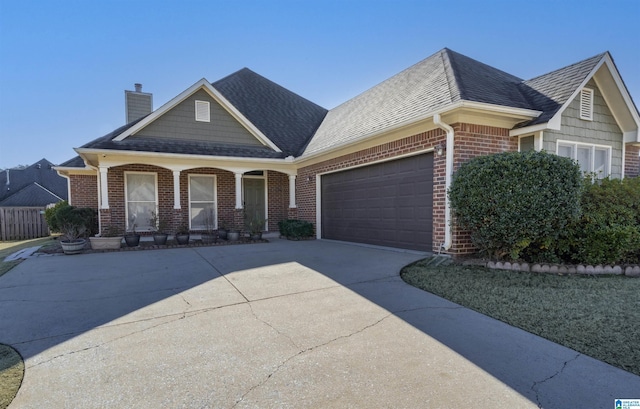 view of front of house with a porch and a garage