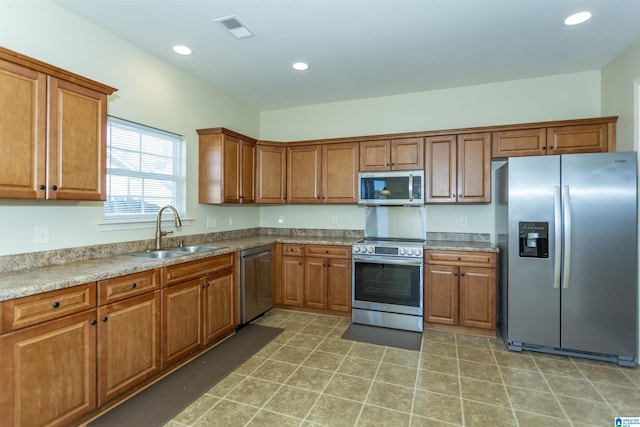 kitchen with sink and appliances with stainless steel finishes