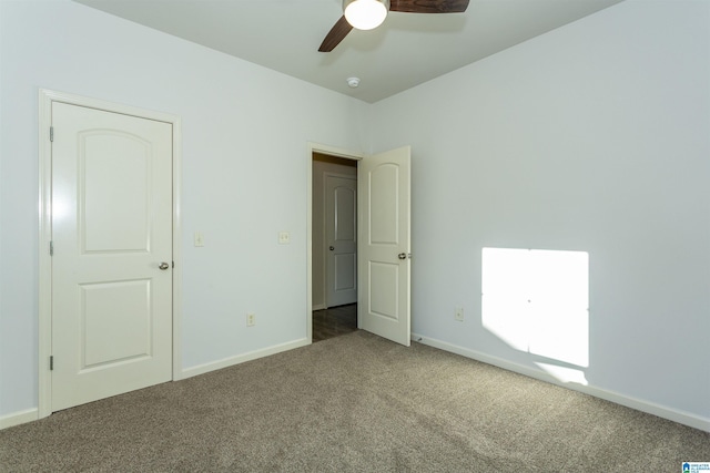 unfurnished bedroom featuring carpet flooring and ceiling fan