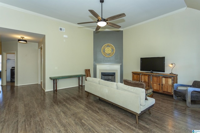 living room with dark hardwood / wood-style floors, ceiling fan, and crown molding