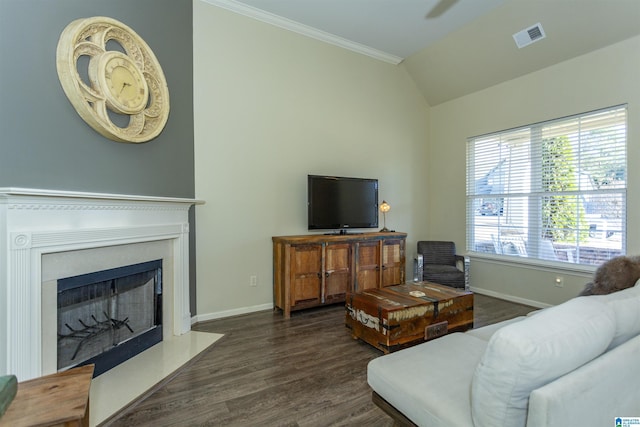 living room with vaulted ceiling, crown molding, and dark wood-type flooring