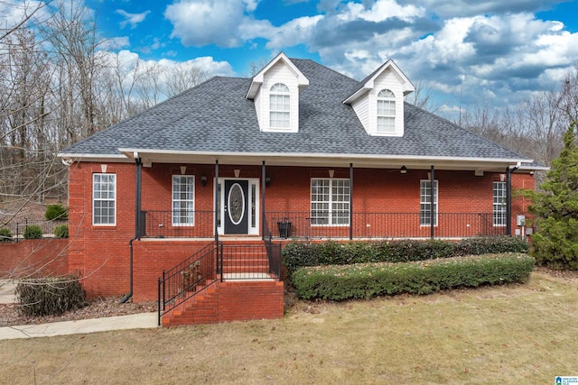 view of front of house with a porch and a front yard