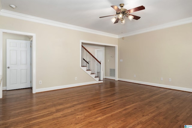 empty room featuring dark wood-type flooring, ceiling fan, and ornamental molding