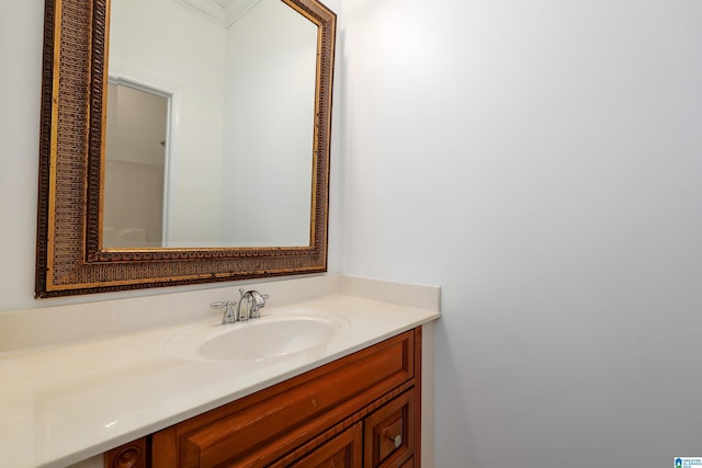 bathroom featuring vanity and ornamental molding