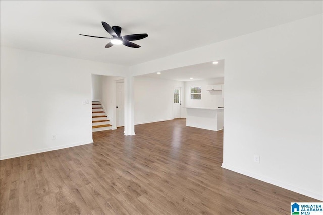 unfurnished living room with ceiling fan and hardwood / wood-style floors