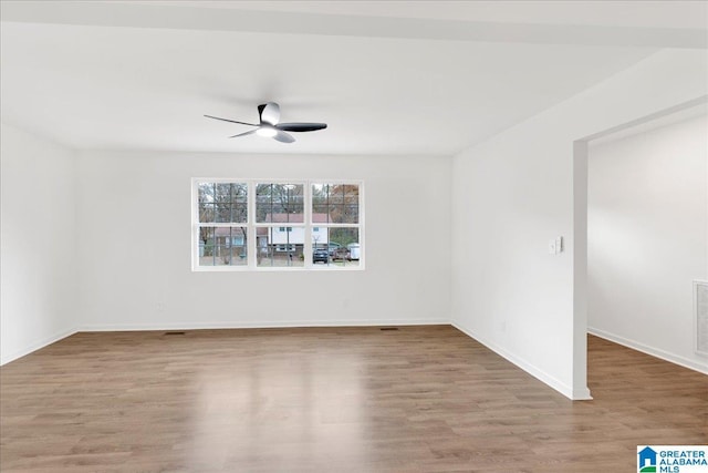 unfurnished room with ceiling fan and light hardwood / wood-style flooring