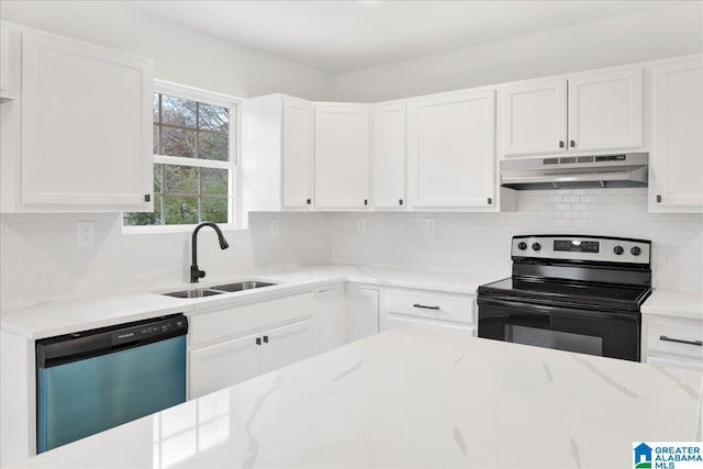 kitchen with white cabinets, backsplash, sink, and appliances with stainless steel finishes