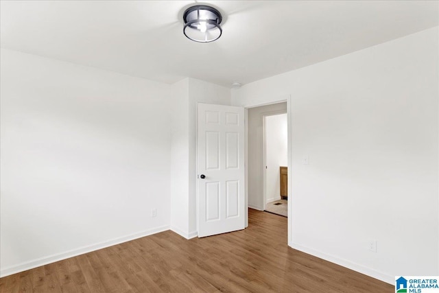 spare room featuring hardwood / wood-style floors