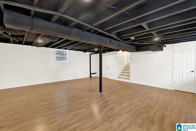 basement with wood-type flooring