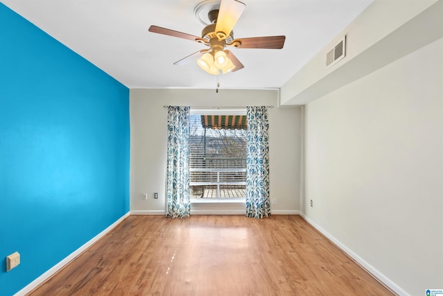 spare room featuring ceiling fan and light wood-type flooring