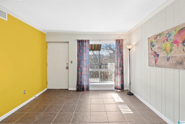 tiled spare room with plenty of natural light and crown molding