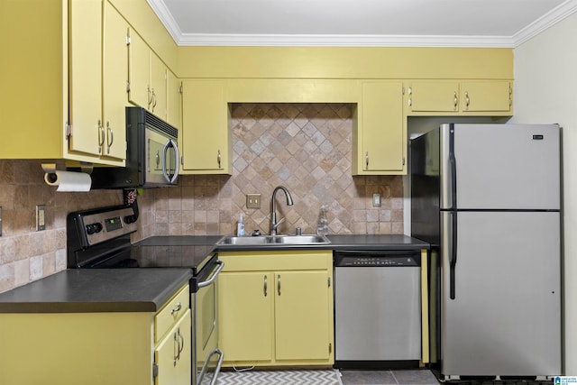 kitchen with decorative backsplash, appliances with stainless steel finishes, ornamental molding, and sink