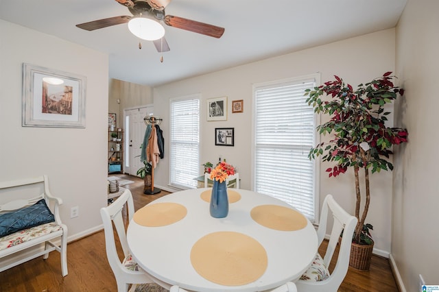 dining area with ceiling fan, plenty of natural light, and hardwood / wood-style flooring