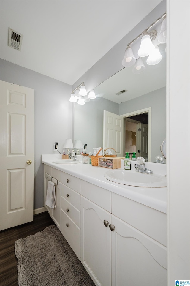 bathroom featuring hardwood / wood-style floors and vanity