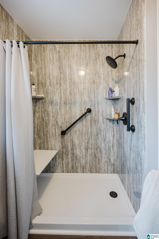 bathroom featuring a shower with curtain