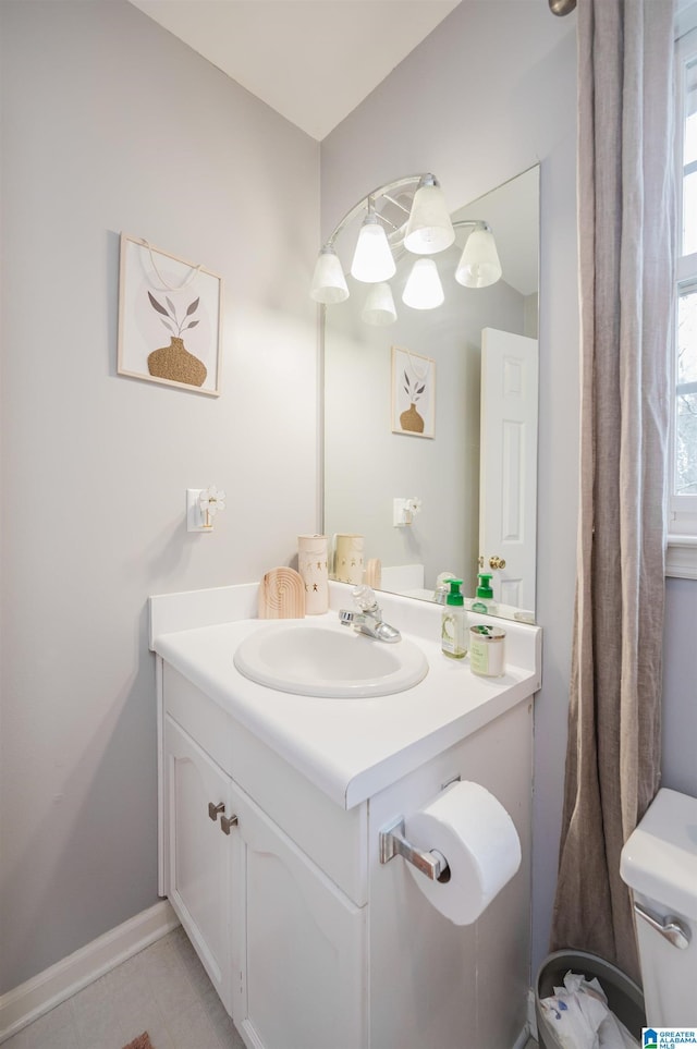 bathroom with vanity and toilet